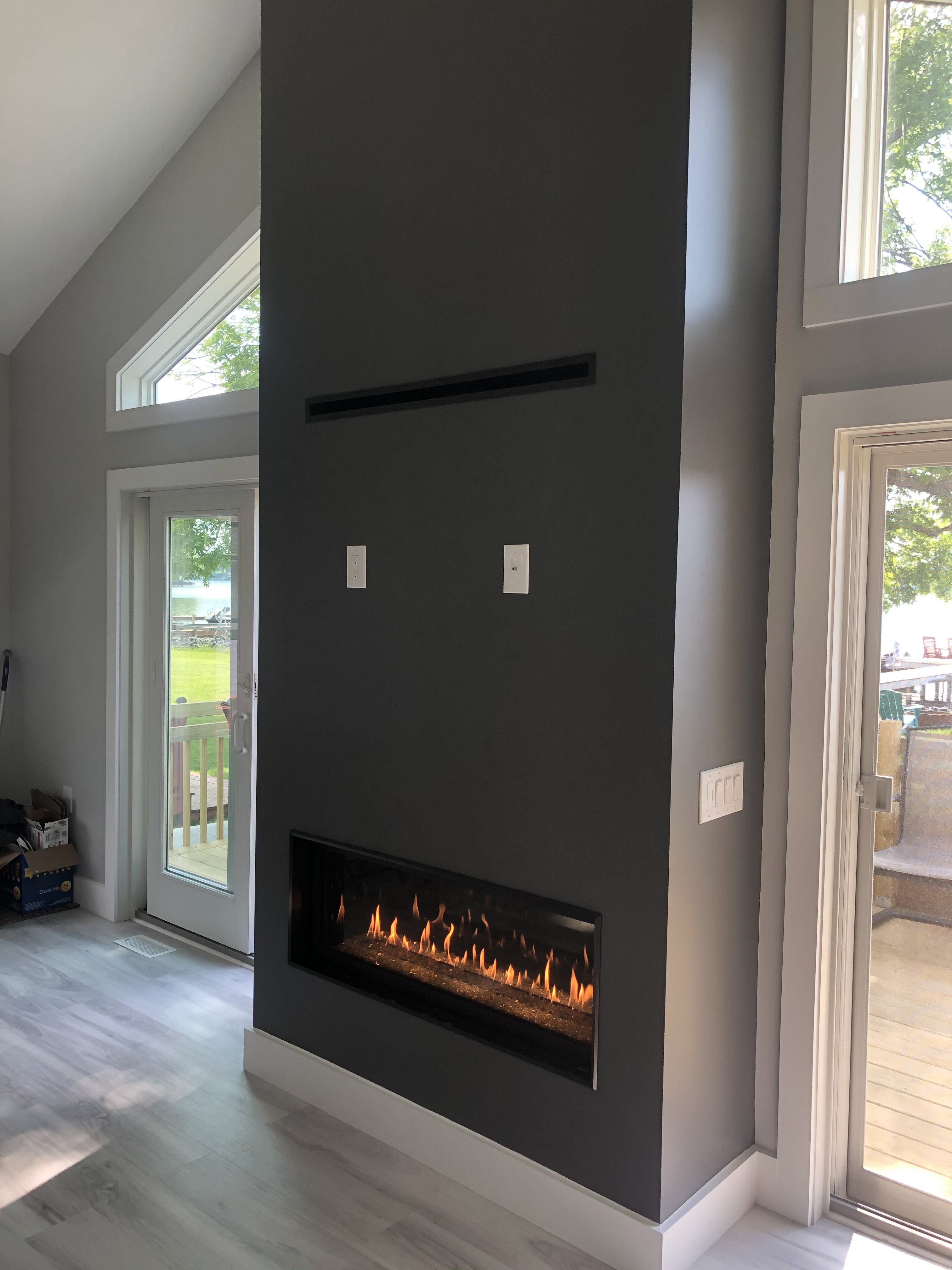 Image of a contemporary 4415HO Lineasr Gas Fireplace by Fireplace Xtordinair featuring a CoolSmart Kit and Painted Wall Finish.