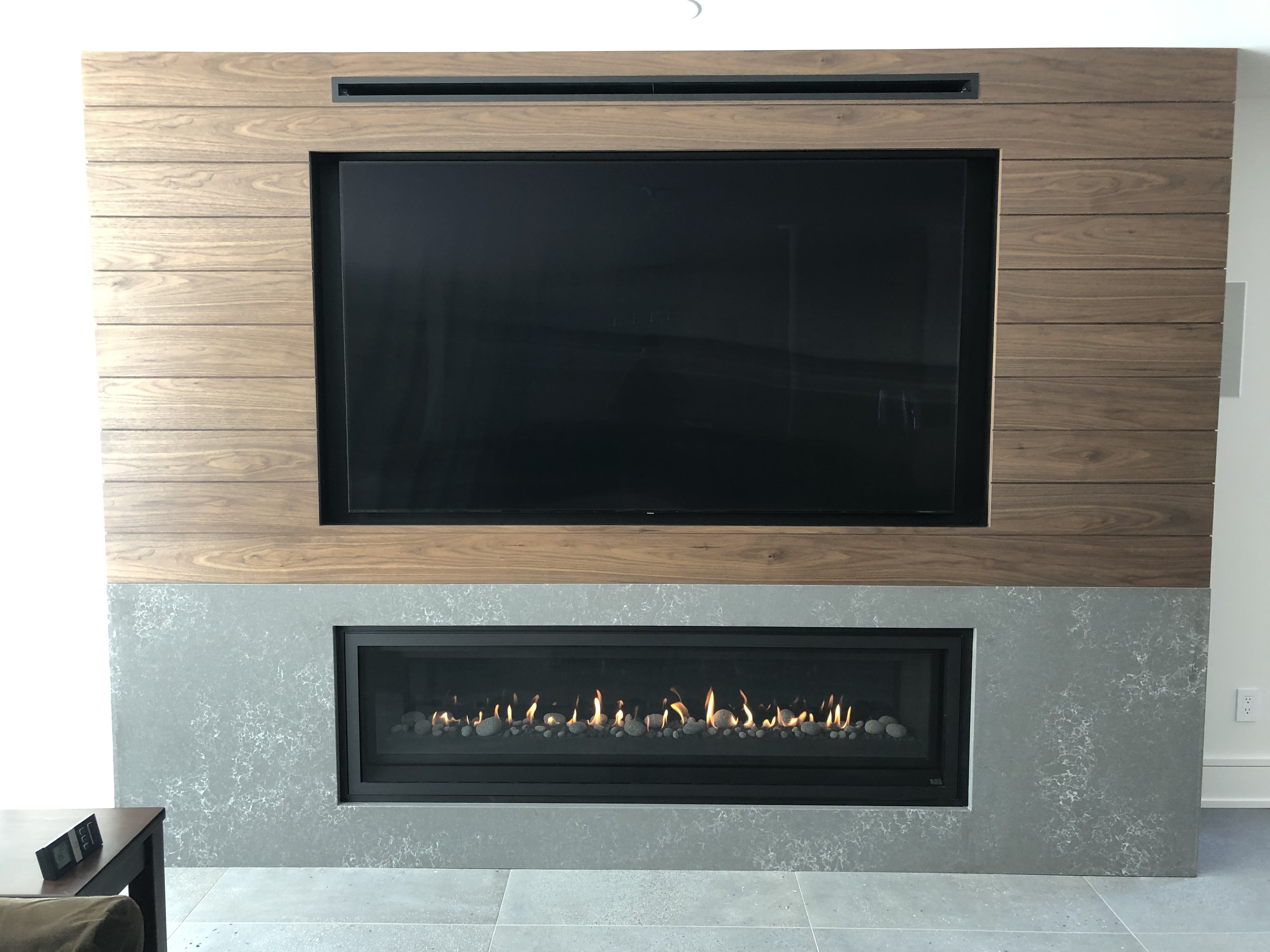Image of a contemporary ProBuilder 72 Linear Gas Fireplace by Fireplace Xtordinair featuring a modern concrete surround.