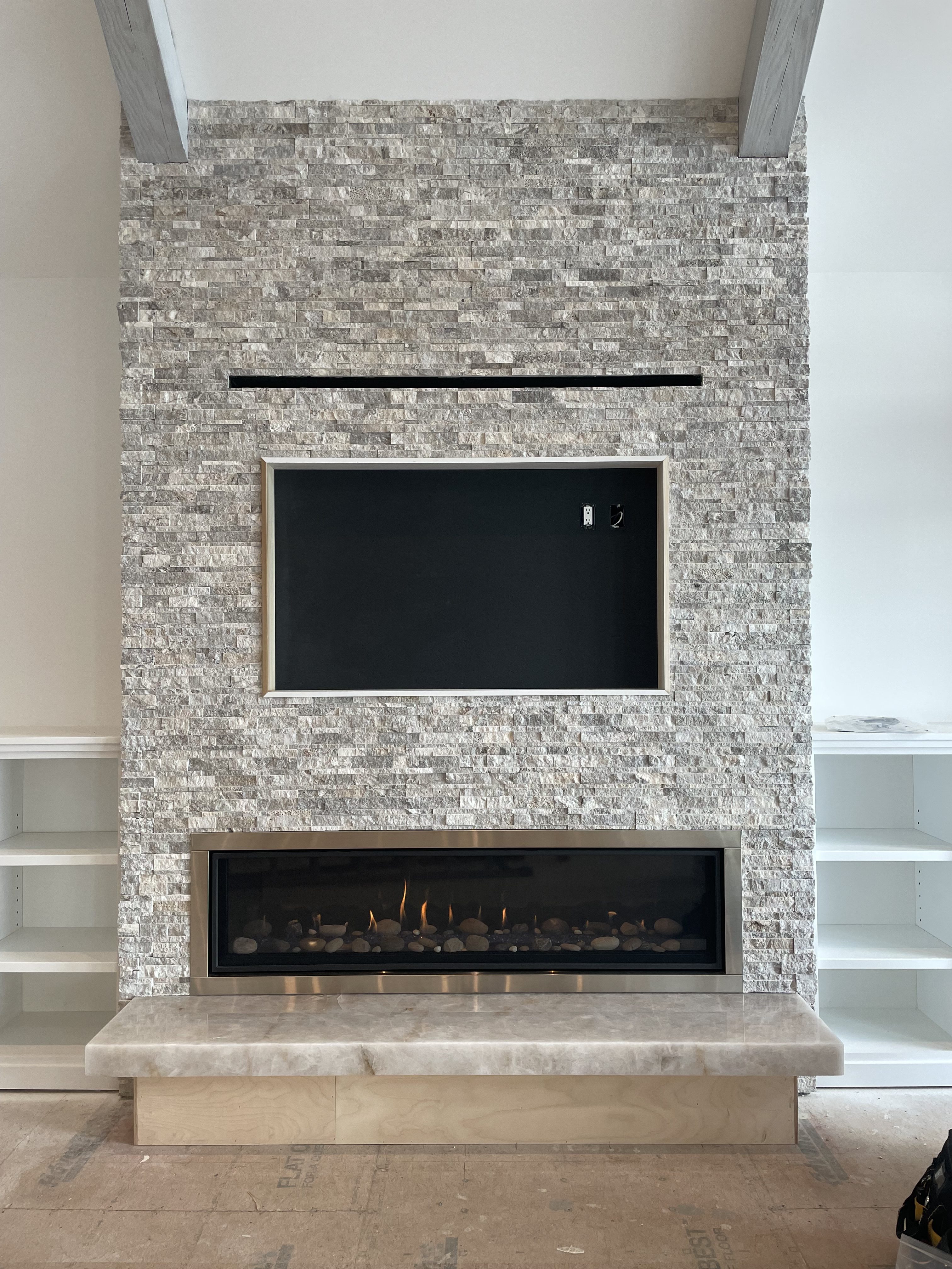 Image of a contemporary Calloway 72 Linear Gas Fireplace featuring a modern stone surround.