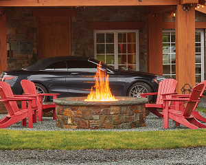 Image of a stunning Round Voracious Fire™ Pit featuring a stone finish with a link to the product page.